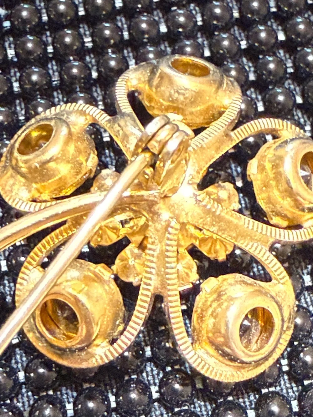 Vintage 70s Gold-Tone Orange Crystal Flower Brooch with Green Leaf Accents